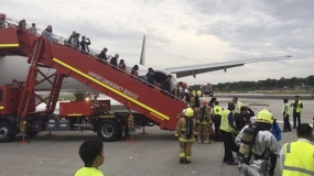 Singapore Airlines plane catches fire after emergency landing