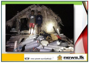 Navy holds two persons with diving gear stored on temporary hut in shallow waters