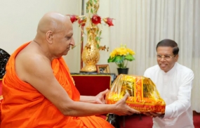 President presents copy of 19A Draft Bill to Malwatta Chief Prelate