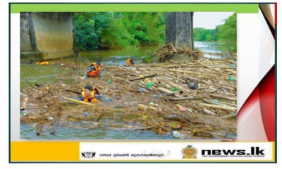 Naval personnel remove woody debris under Aviththawa Bridge